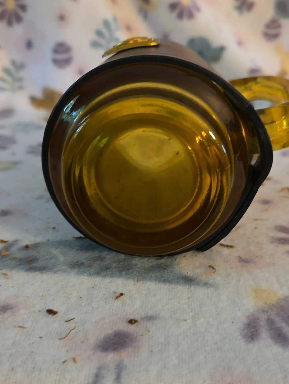 Vintage amber glass beer mug featuring a fitted brown leather wrap